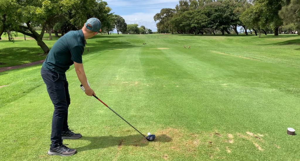 how to overcome golf anxiety on the first tee: A photo of the Astute Golf Writer lining up on the first tee.